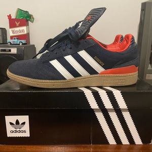 Adidas Busenitz men’s size 10. Navy/orange/white. Brand new with box.